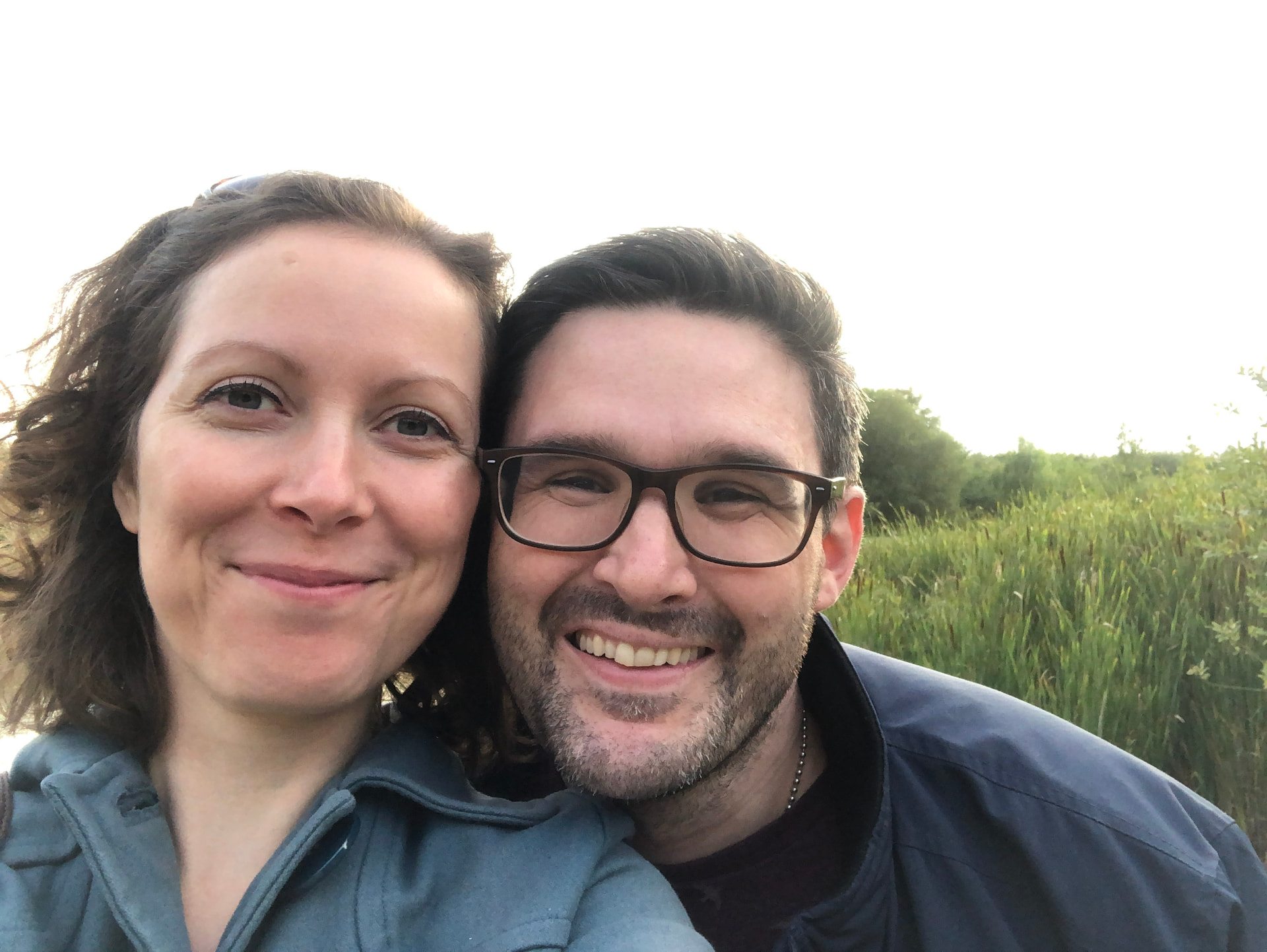Jason and Emma smiling together outdoors